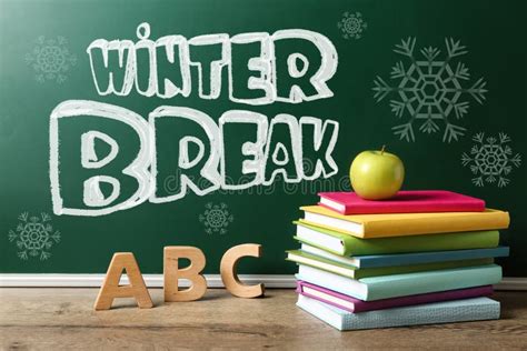 Text Winter Break on School Chalkboard Near Table with Books, Letters ...