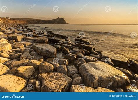 Rocky Dorset Coastline at Sunset Stock Photo - Image of beach, beauty ...