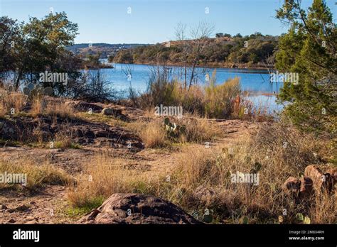 Texas Hill Country hiking trail with a view of Inks Lake. The path ...