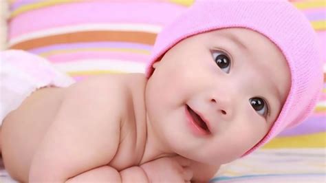 Cute Little Baby Is Lying Down On Bed Wearing Pink Woolen Knitted Cap HD Cute Wallpapers | HD ...