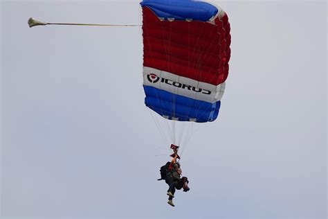 Texas governor skydives for first time alongside 106-year-old World War ...