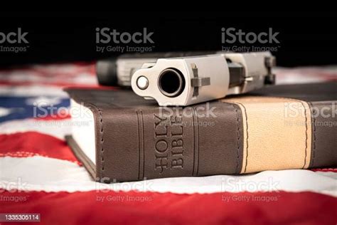 Gun On Holy Bible Stock Photo - Download Image Now - Bible, Flag, Gun - iStock