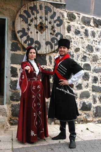 Lower Galilee, Circassian couple in traditional clothing at Kfar Kama ...