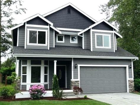 Small Dark Grey House With White Trim, dark grey house exterior with white trim and pergola ...