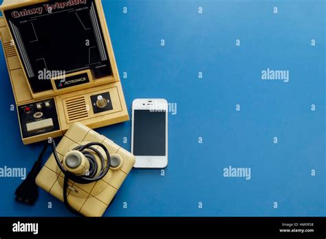 1980s gaming consoles and accessories have been replaced by modern smartphones Stock Photo - Alamy