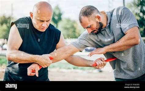 Knife vs knife fight. Kapap instructor demonstrates martial arts self ...