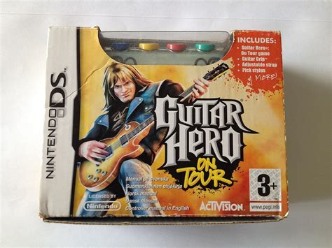 Guitar Hero: On Tour - Guitar Grip Bundle (Nintendo DS): Computer and ...