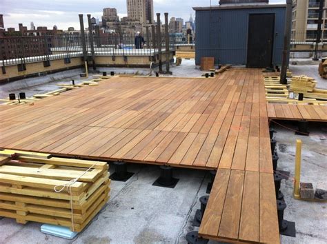 the wooden deck is being constructed on top of an old building in new ...