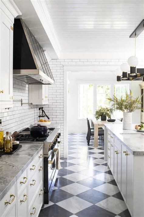 10 Black and White Kitchens That Won't Age | White kitchen tiles, Timeless kitchen, White ...