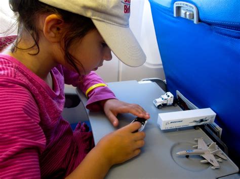 Playing with a Boeing play set in an Airbus airplane