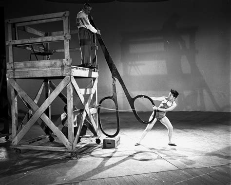 an advertisement for the circus shows a woman with two hoop rings in front of her