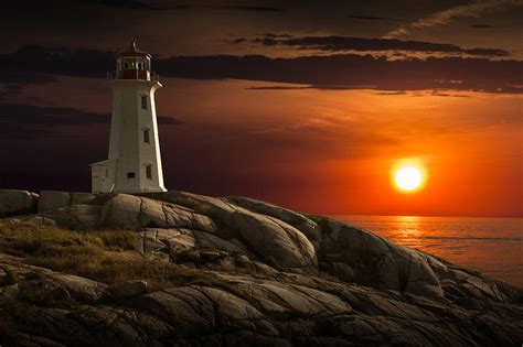 Lighthouse At Sunset In The Peggy's Cove Photograph by Randall Nyhof