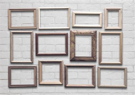 Frames on white wall stock photo. Image of background - 234758582