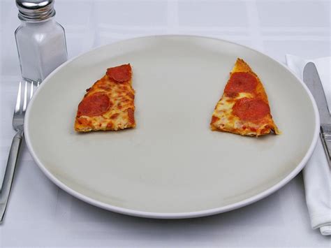 Calories in 1 slice of PIZZA HUT 14" Pepperoni Pizza, THIN 'N CRISPY Crust.