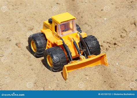 Toy yellow tractor stock photo. Image of preschool, summer - 45155722