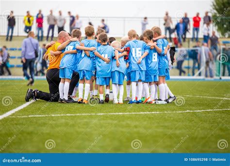 Children Soccer Football Team with Coach. Group of Kids Standing Together on the Pitch Editorial ...