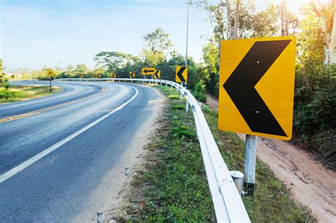 Curve Warning Sign On The Road Stock Photo - Download Image Now - iStock