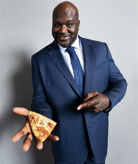 Shaq Holding Things