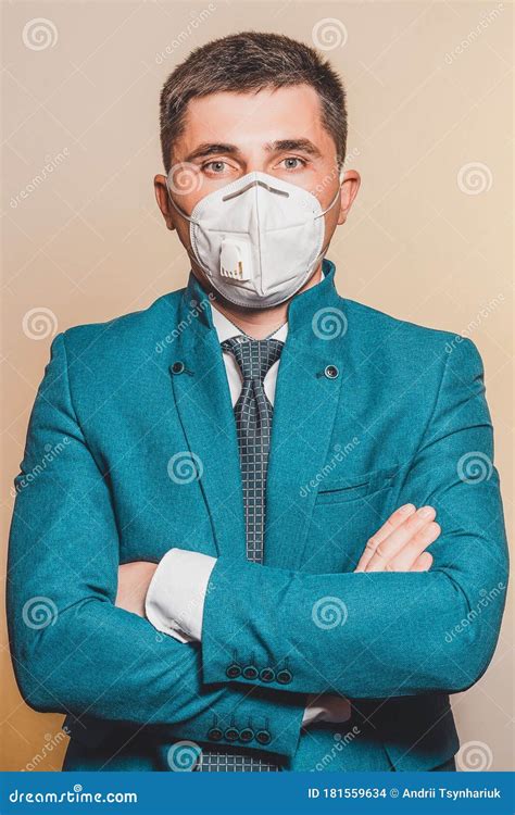 Business Manager in Medical Mask Confidently Stands with Crossed Hands. Conceptual Photo Showing ...