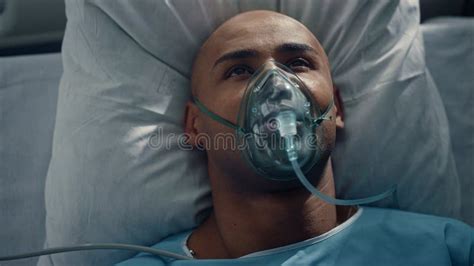 Portrait Patient Breathing Oxygen Mask Lying in Bed Hospital Emergency Unit. Stock Image - Image ...