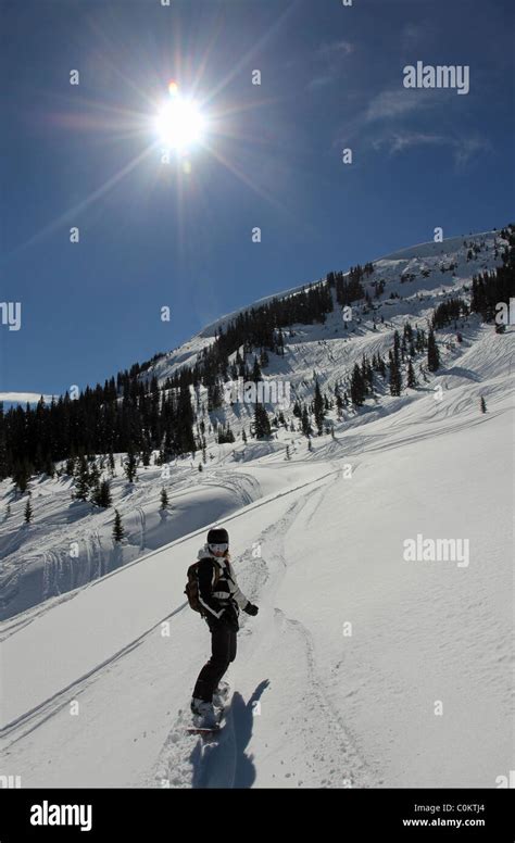 Young woman snowboarding in Vail, Colorado Stock Photo - Alamy