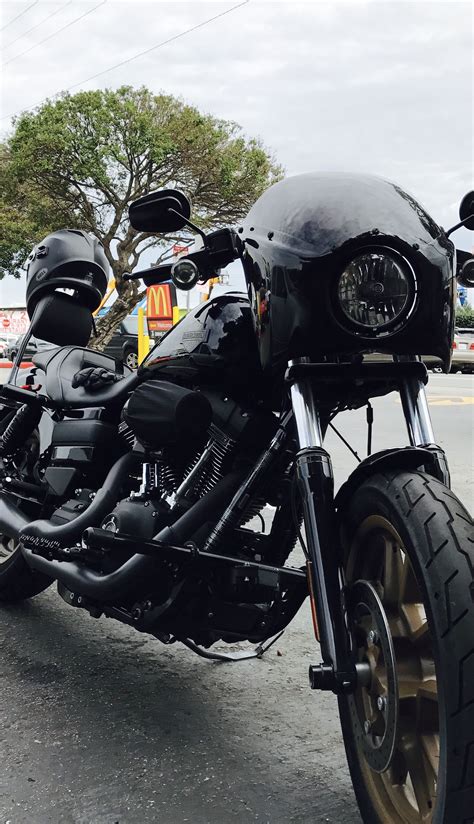 a black motorcycle parked on the side of the road