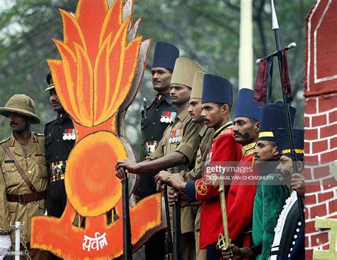 Indian soldiers display the various uniforms of the Army along the... News Photo - Getty Images