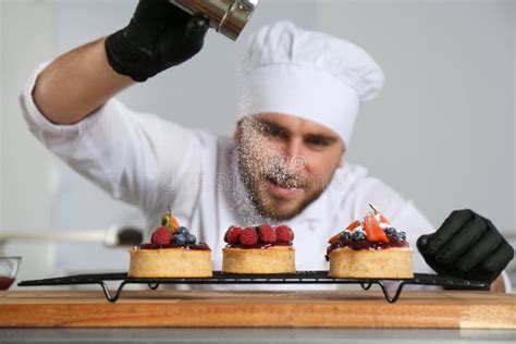 Male Pastry Chef Sprinkling Desserts with Sugar Powder Stock Image ...