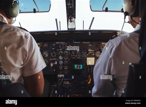 Two pilots in the cockpit of a Dornier 228 Stock Photo - Alamy