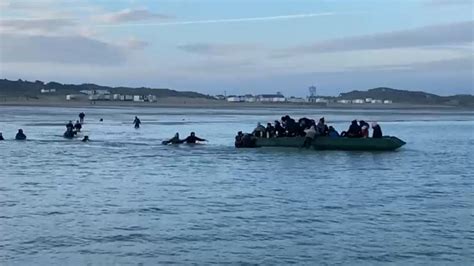 Channel crossings: Migrants seen getting on inflatable dinghy off ...