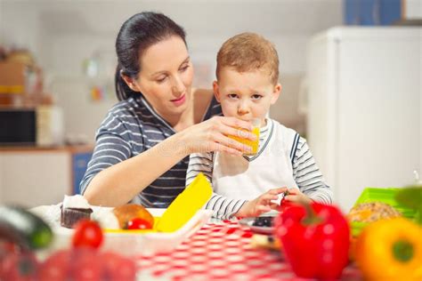 Mother Making Breakfast for Her Children in the Morning at Home Stock Photo - Image of apple ...