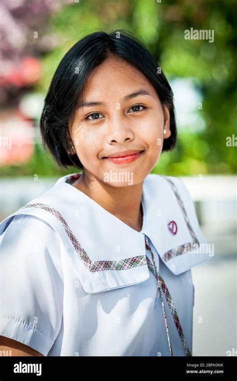 A beautiful Filipino school girl poses in a park in Angeles City, Philippines Stock Photo - Alamy