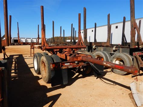 HOMEMADE LOG TRAILER, - T/A, 2 BOLSTER, POLE TRAILER - J.M. Wood Auction Company, Inc.