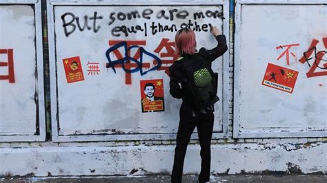 Brick Lane: Chinese political slogans appear on London street art wall ...