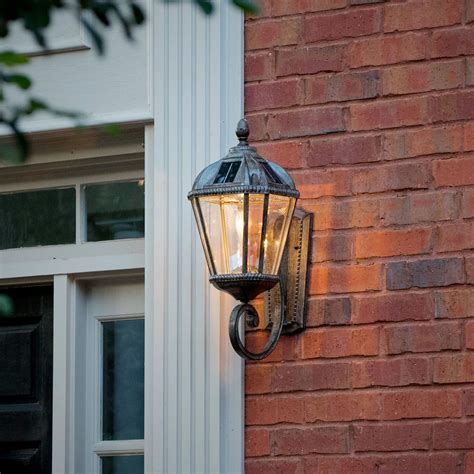 Welcome guests to your home in Royal fashion with this outdoor solar powered wall sconce ...