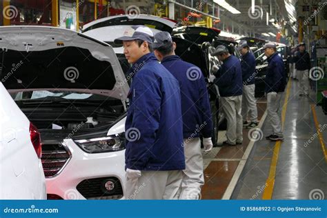 Workers Assemble a Car on Assembly Line in Car Factory Editorial ...