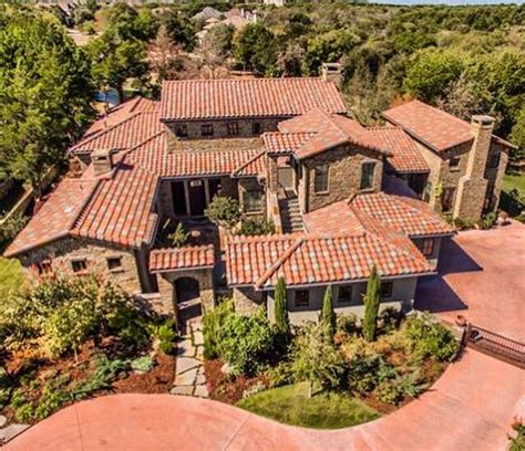 Architectural Designs Tuscan-Inspired Luxury House Plan 36522TX has an open central courtyard ...