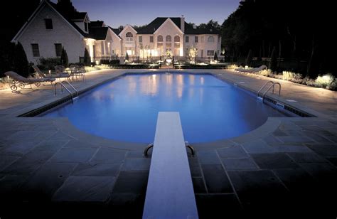 The landscape and pool area lighting make this mesmerizing. | Outdoor lighting design, Pool ...