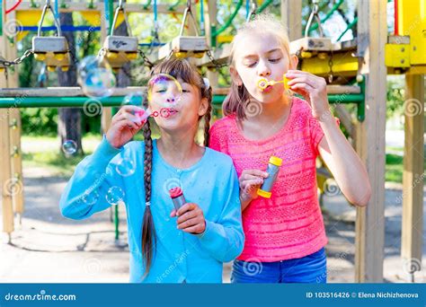 Kids with soap bubbles stock photo. Image of meadow - 103516426