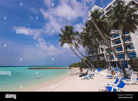 Maafushi, Maldives - June 25, 2021: People near the White Sandy Beach ...