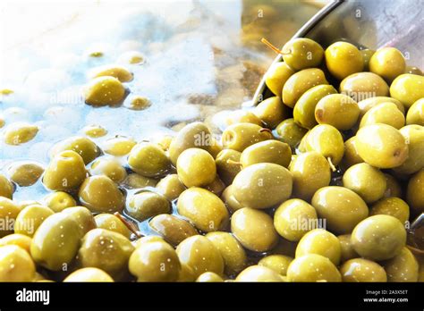 Green olives in brine, Iran Stock Photo - Alamy