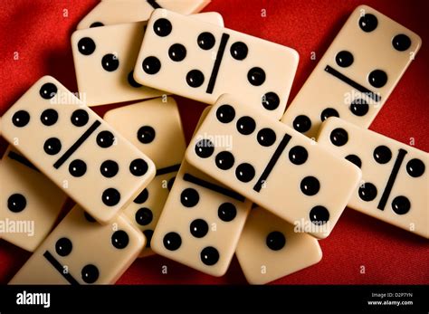 dominoes pieces scattered Stock Photo - Alamy