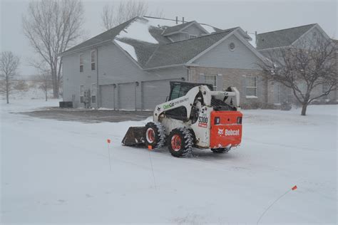 Snow Plowing Skid Steer - Green Thumb Advice