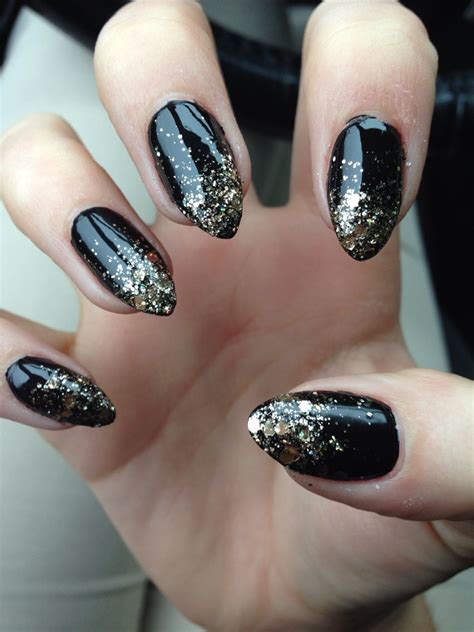 Stiletto nails: black with gold glitter ombré | Gold stiletto nails, Gold nails, Trendy nails