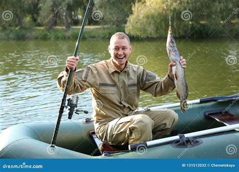 Man with Rod and Catch Fishing from Boat Stock Photo - Image of angling, lifestyle: 131512032