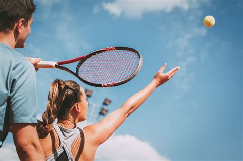 Girl Practice Tennis With Coach Stock Photo - Download Image Now - iStock