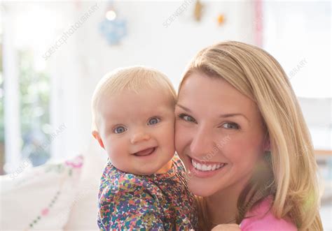 Mother holding baby girl - Stock Image - F014/4813 - Science Photo Library