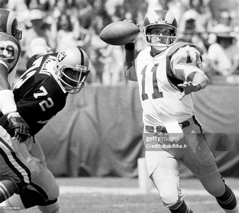 Los Angeles Rams quarterback Pat Haden is under heavy pressure from... News Photo - Getty Images