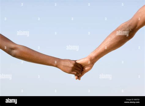 Man and woman holding hands Stock Photo - Alamy