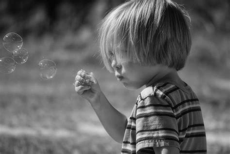 grayscale photograph, toddler, blowing, bobbles, soap bubbles, boy, bubbles, child, fun, happy ...